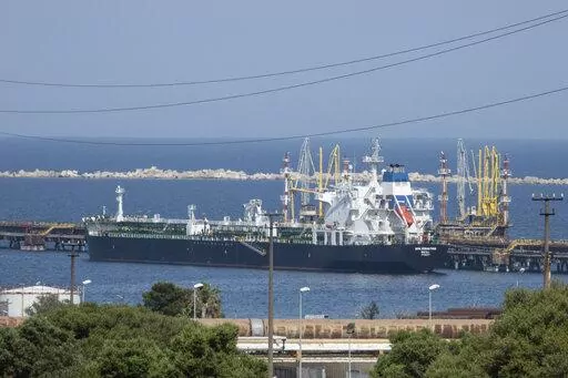 The San Sebastian oil tanker is moored at the docks of the ISAB refinery in Priolo-Gargallo near Syracuse, Sicily, May 31, 2022. The ISAB is owned by Russia's Lukoil. The U.S. and its allies are navigating questions as they plan to impose a price cap on Russian oil by December. (AP Photo/Gaetano Adriano Pulvirenti, File)