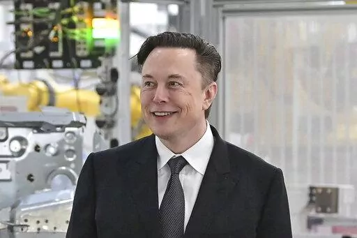 Tesla CEO Elon Musk attends the opening of the Tesla factory Berlin Brandenburg in Gruenheide, Germany on March 22, 2022. Musk says his deal to buy Twitter can’t ‘move forward’ unless the company shows public proof that less than 5% of the accounts on the platform are fake or spam. Musk made the comment in a reply to another user on Twitter early Tuesday, May 17, 2022. (Patrick Pleul/Pool Photo via AP, File)
