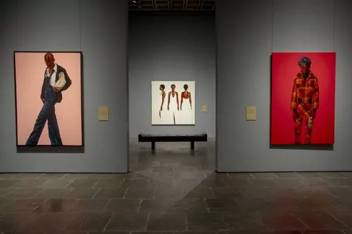 Artworks from the Barkley L. Hendricks exhibition are displayed on Monday, Sept. 18, 2023 at The Frick Madison in New York. Hendricks, who died in 2017, is the first artist of color to have a solo exhibit at the Frick. “Barkley L. Hendricks: Portraits at the Frick” is open now through Jan. 7, 2024. (Photo by Andy Kropa/Invision/AP)