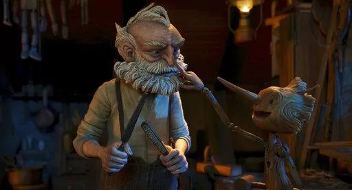 This image released by Netflix shows Gepetto, voiced by David Bradley, left, and Pinocchio, voiced by Gregory Mann, in a scene from "Guillermo del Toro's Pinocchio." (Netflix via AP)