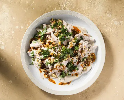 This image released by Milk Street shows a recipe for Circassian chicken, a popular Turkish meze dish and an elevated form of chicken salad. (Milk Street via AP)