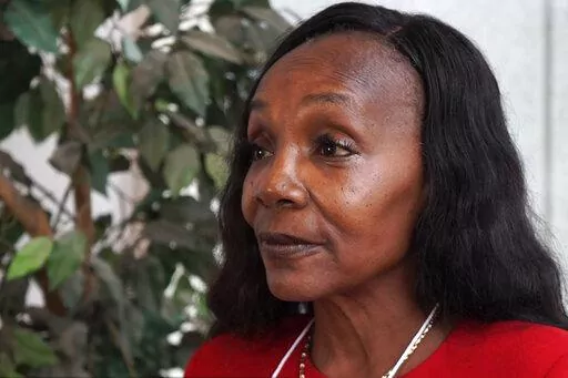 In this still photo provided by Ethereal Films, Brenda Hampton attends the National PFAS Conference, in Boston, in June 2019. Hampton, a mother and grandmother, who believes tainted water led to her kidney problems, found that PFAS seemed to be in everything, including fast food packaging. Concerned that her children were ingesting the chemicals as they ate french fries and burgers, she joined the fight to get it banned from McDonald's. (Elijah Yetter-Bowman/Ethereal Films via AP)