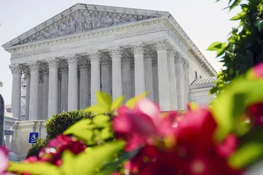 The U.S. Supreme Court is seen on July 13, 2023, in Washington. In arguments on Nov. 1, Supreme Court justices will weigh a California man's attempt to trademark a phrase mocking former President Donald Trump as "too small."(AP Photo/Mariam Zuhaib, File)