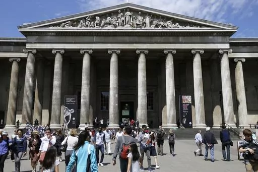 Visitors walk outside the British Museum in Bloomsbury, London, Friday, June 26, 2015. The British Museum is suing a former curator alleged to have stolen almost 2,000 artifacts from its collections and offered them for sale online. Peter Higgs was fired in July 2023 after more than 1,800 items were discovered to be missing. (AP Photo/Tim Ireland, File)