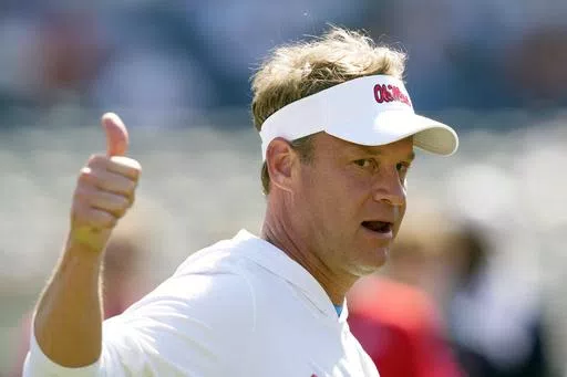 Mississippi coach Lane Kiffin shows his approval at his players efforts in a number of non-football events that were part of the the NCAA college football team's spring game, Saturday, April 13, 2024, in Oxford, Miss. The spring portal window in college football is closed. Kiffin lived up to the portal king moniker as the Rebels went all in. (AP Photo/Rogelio V. Solis, File)