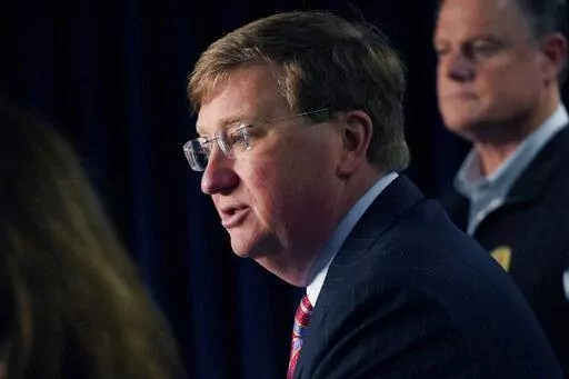 Mississippi Gov. Tate Reeves announces the state imposed boil-water notice has been lifted in Mississippi's capital city after nearly seven weeks, while Mississippi Emergency Management Agency executive director Stephen C. McCraney, right, listens, during a Sept. 15, 2022, news conference in Jackson. Repairs are still underway after problems at Jackson's main water treatment plant caused most customers to lose service for several days in late August and early September. Reeves blames Jackson's w