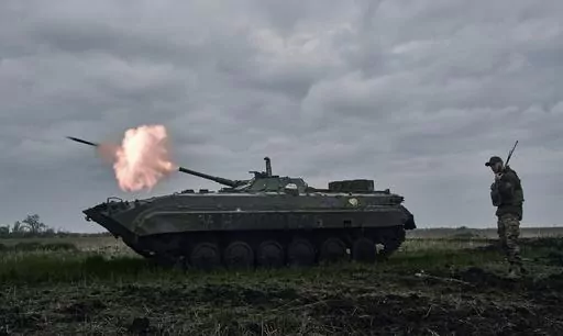 A Ukrainian APC fires towards Russian positions near Avdiivka, in the Donetsk region, Ukraine, Friday, April 28, 2023. A dayslong attempt by Russian forces to storm a strategically important city in eastern Ukraine appears to be running out of steam, Kyiv officials claimed Monday, Oct. 16, 2023 as the Kremlin’s war entered its 600th day. (AP Photo/Libkos, File)
