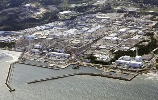 This aerial view shows the wrecked Fukushima Daiichi nuclear power plant in Okuma town, northeastern Japan, on Aug. 24, 2023. A drone small enough to fit in one's hand flew inside one of the damaged reactors at the wrecked nuclear power plant Wednesday, Feb. 28, 2024, in hopes it can examine some of the molten fuel debris in areas where earlier robots failed to reach. (Kyodo News via AP, File)