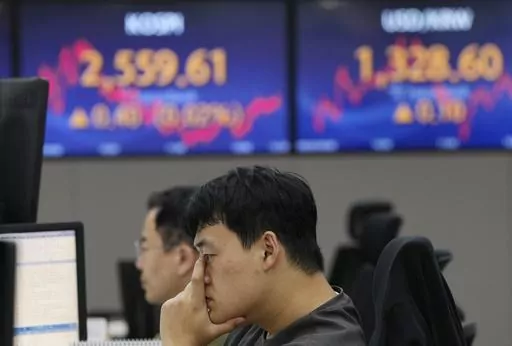 A currency trader watches monitors at the foreign exchange dealing room of the KEB Hana Bank headquarters in Seoul, South Korea, on Sept. 20, 2023. Share prices were mixed on Monday, Oct. 9, after the Israeli government declared war following deadly attacks by Hamas from the Gaza Strip. (AP Photo/Ahn Young-joon, File)