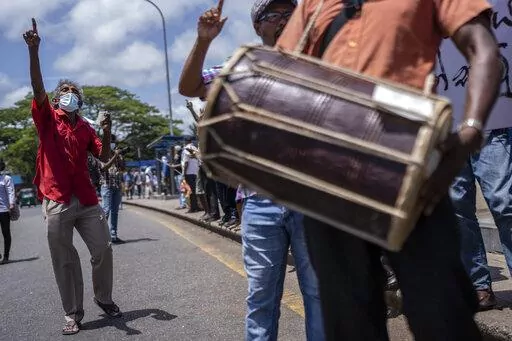 Trade union representatives and activists shout slogans during a protest against Sri Lanka’s acting president Ranil Wickremesinghe in Colombo, Sri Lanka, Monday, July 18, 2022. Wickremesinghe on Monday declared a state of emergency giving him broad authority amid growing protests demanding his resignation two days before the country's lawmakers are set to elect a new president. (AP Photo/Rafiq Maqbool)