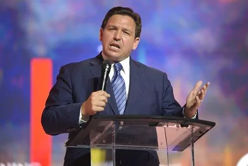 Florida's Republican Gov. Ron DeSantis addresses attendees during the Turning Point USA Student Action Summit, Friday, July 22, 2022, in Tampa, Fla. DeSantis' effort to place candidates fully aligned with his conservative views on school boards throughout the state is helping him expand his influence. Of the 30 candidates endorsed by DeSantis in the Aug. 23 elections, 19 won, five lost and six are headed to runoffs. (AP Photo/Phelan M. Ebenhack, File)