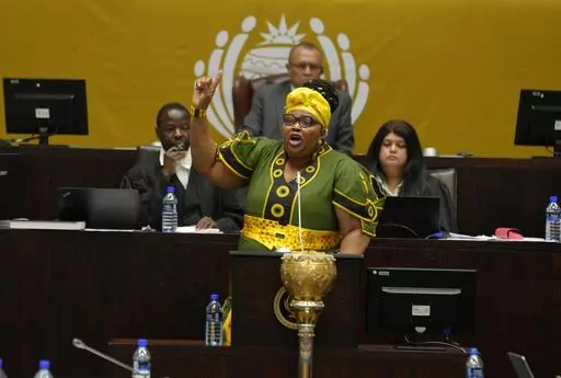 Pemmy Majodina, chief whip of the ruling African National Congress, addresses members of parliament in Cape Town, South Africa, Tuesday, Nov. 21, 2023. The majority of MP's voted to close the Israeli embassy in South Africa over the war in Gaza. (AP Photo/Nardus Engelbrecht)
