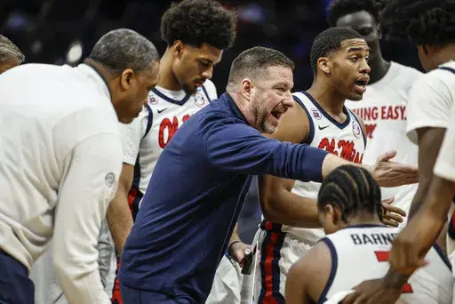 Mississippi coach Chris Beard talks to his players during a break against North Carolina in the first round of the NCAA college basketball tournament Friday, March 21, 2025, in Milwaukee. (AP Photo/Jeffrey Phelps)