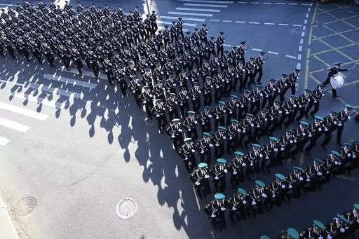 Russian soldiers march toward Red Square to attend a dress rehearsal for the Victory Day military parade in Moscow, Russia, Sunday, May 7, 2023. The parade will take place at Moscow's Red Square on May 9 to celebrate 78 years of the victory in WWII. (AP Photo)