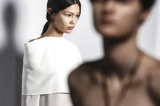 Fashion from Proenza Schouler latest collection is modeled backstage in a first-look setup, during Fashion Week, Saturday Feb. 11, 2023 in New York. (AP Photo/Bebeto Matthews)