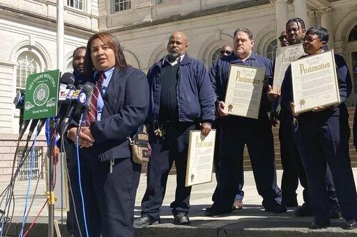 New York City subway train conductor Raven Haynes, who was responsible for making passenger announcements and monitoring the boarding and alighting of the train, during the recent subway attack, speaks at New York City Hall, Friday, April 15, 2022. Haynes and fellow transit workers were honored by Mayor Eric Adams for their response to Tuesday's shooting. (AP Photo/Michelle Price)