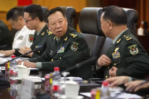 China's People's Liberation Army (PLA) Gen. Li Zuocheng, center, speaks during a meeting with U.S. Army Chief of Staff Gen. Mark Milley, not shown, at the Bayi Building in Beijing on Aug. 16, 2016. China has demanded the U.S. cease military "collusion" with Taiwan during a virtual meeting between the joint chiefs of staff from the two countries, whose relationship has grown increasingly fractious. (AP Photo/Mark Schiefelbein, Pool, File)