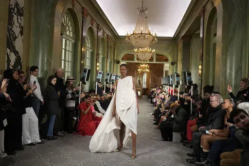 A model wears a creation as part of the Imane Ayissi Haute Couture Spring Summer 2025 collection, that was presented in Paris, Monday, Jan. 27, 2025. (AP Photo/Lewis Joly)