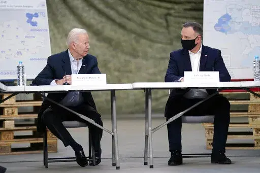 President Joe Biden and Polish President Andrzej Duda participate in a roundtable on the humanitarian response to the Russian invasion of Ukraine, Friday, March 25, 2022, in Jasionka, Poland. (AP Photo/Evan Vucci)