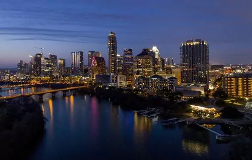 Lights from inside buildings illuminate the skyline, Monday, Feb. 5, 2018, in Austin, Texas. Some of the largest U.S. cities challenging their 2020 census numbers aren't getting the results they hoped for from the U.S. Census Bureau. (Jay Janner/Austin American-Statesman via AP, File)