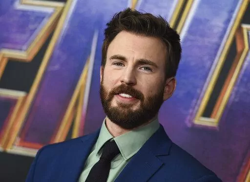 Chris Evans arrives at the premiere of "Avengers: Endgame" on April 22, 2019, in Los Angeles.  The “Captain America” star has a new title — he's been named People magazine's Sexiest Man Alive. The selection was announced Monday night, Nov. 7, 2022, on Stephen Colbert's late night show and on the magazine's website. (Photo by Jordan Strauss/Invision/AP, File)