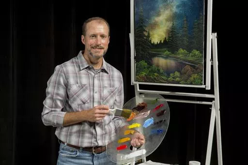 Nicholas Hankins appears in the studio during a taping of "The Joy of Painting with Nicholas Hankins: Bob Ross' Unfinished Season." (Derek Sanford/WDSC-TV via AP)