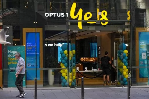 A customer waits for service at a Optus phone store in Sydney, Australia, Thursday, Oct. 7, 2021. The Australian government said on Monday, Sept. 26, 2022, it was considering tougher cybersecurity rules for telecommunications companies after Optus, the nation’s second-largest wireless carrier, reported personal data of 9.8 million customers had been breached. (AP Photo/Mark Baker, File)