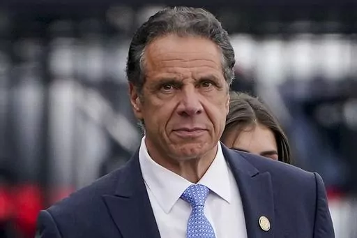 New York Gov. Andrew Cuomo prepares to board a helicopter after announcing his resignation, Aug. 10, 2021, in New York. On Friday, Jan. 26, 2024, the U.S. Justice Department reached a settlement with the state of New York to resolve a sexual harassment investigation of former Gov. Cuomo, confirming allegations from the damaging misconduct probe that led to the Democrat's resignation. (AP Photo/Seth Wenig, File)