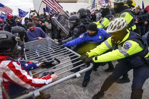 Rioters try to break through a police barrier at the Capitol in Washington on Jan. 6, 2021. News organizations are using sophisticated new technologies to transform the way they conduct investigations. Much of it is publicly available, or “open-source” material from mobile phones, satellite images and security cameras, but it also extends to computer modeling and artificial intelligence. A reporting form that barely existed a decade ago is becoming an important part of journalism's future. (