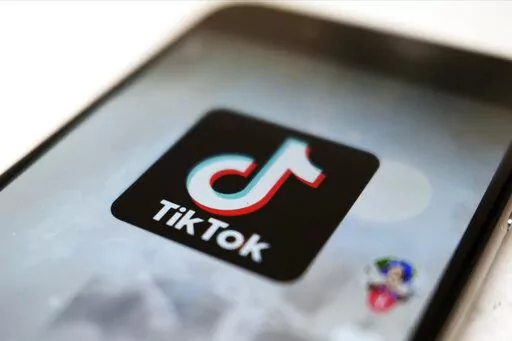 This Monday, Sept. 28, 2020, file photo, shows the TikTok logo on a smartphone in Tokyo. On Sunday, March 6, 2022, Netflix and TikTok suspended most of their services in Russia as the government cracks down on what people and media outlets can say about Russia's war in Ukraine. (AP Photo/Kiichiro Sato, File)