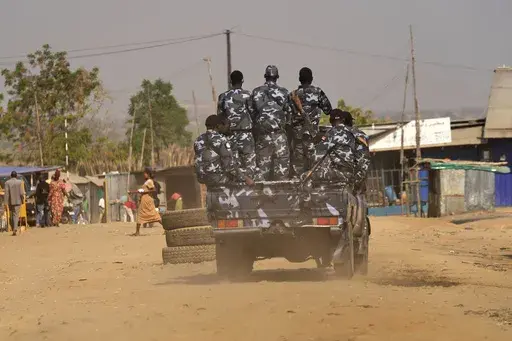 South Sudan soldiers patrol the street in Juba, South Sudan on Thursday, Feb. 13, 2025. (AP Photo/Brian Inganga)