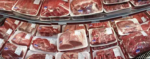 In this Nov. 2, 2013 file photo, various cuts of beef and pork are displayed for sale in the meat department at a discount market in Arlington, Va. (AP Photo/J. Scott Applewhite, File)