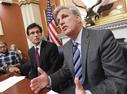 Then-House Majority Whip Kevin McCarthy of Calif., right, joined by House Majority Leader Eric Cantor of Va., speaks to reporters about President Obama's debt reduction plan and other issues, on Capitol Hill in Washington, on Sept. 20, 2013. Lessons learned from the debt ceiling standoff more than a decade ago are rippling through Washington. Back in 2011 the debate around raising the debt ceiling was eerily familiar. Newly elected House Republicans were eager to confront the Democratic presiden
