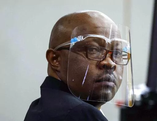 Accused serial killer Billy Chemirmir looks back during his retrial on April 25, 2022, at Frank Crowley Courts Building in Dallas. A man who has been charged with killing 22 women in the Dallas area is set to go on trial in the death of an 87-year-old woman. Billy Chemirmir's capital murder trial in the death of Mary Brooks is scheduled to begin Monday, Oct. 3, 2022, in Dallas. (Shafkat Anowar/The Dallas Morning News via AP, Pool, File)