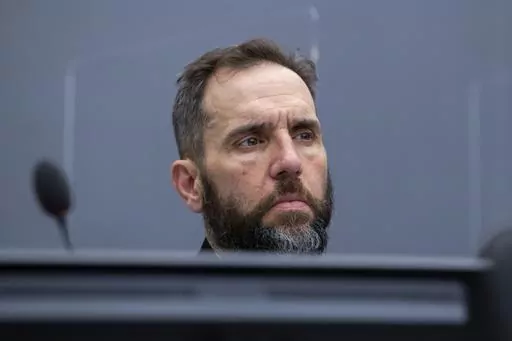 Prosecutor Jack Smith waits for the start of the court session of Kadri Veseli's initial appearance at the Kosovo Specialist Chambers court in The Hague, Netherlands, Nov. 10, 2020. Smith, the prosecutor named as special counsel to oversee investigations related to former President Donald Trump, has a long career confronting public corruption and war crimes. (AP Photo/Peter Dejong, Pool, File)