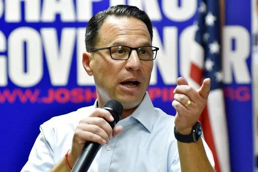 Josh Shapiro, Pennsylvania's Democratic nominee for governor, speaks to the crowd during a campaign event at Adams County Democratic Party headquarters, Sept. 17, 2022, in Gettysburg, Pa. (AP Photo/Marc Levy)
