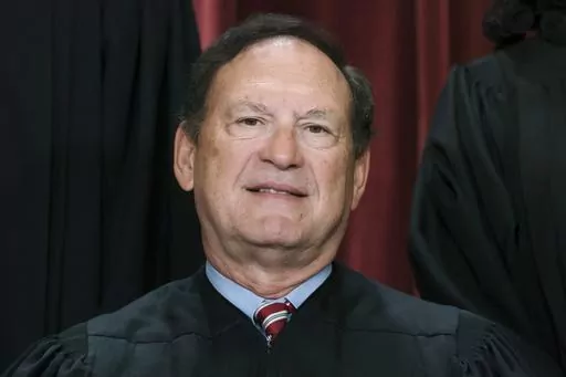 Associate Justice Samuel Alito joins other members of the Supreme Court as they pose for a new group portrait, Oct. 7, 2022, at the Supreme Court building in Washington. Alito said in an interview he gave to the Wall Street Journal opinion pages, published Friday, July 28, 2023, that Congress lacks the power to impose a code of ethics on the Supreme Court, making him the first member of the court to take a public stand against proposals in Congress to toughen ethics rules for justices in respons