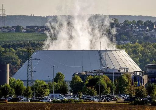 Smoke rises from the nuclear power plant of Nerckarwestheim in Neckarwestheim, Germany, on Aug. 22, 2022. Europe is staring an energy crisis in the face. The cause: Russia throttling back supplies of natural gas. European officials say it's a pressure game over their support for Ukraine after Russia's invasion. (AP Photo/Michael Probst, File)