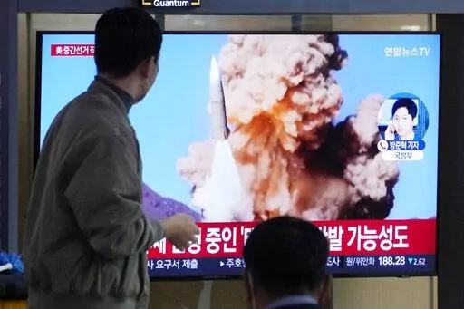 A TV screen shows a file image of North Korea's missile launch during a news program at the Seoul Railway Station in Seoul, South Korea, Wednesday, Nov. 9, 2022. North Korea fired at least one ballistic missile toward its eastern sea on Wednesday as it extended a recent barrage of weapons demonstrations including what it described as simulated attacks on South Korean and U.S. targets last week. (AP Photo/Ahn Young-joon)