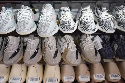 Yeezy shoes made by Adidas are displayed at Laced Up, a sneaker resale store, in Paramus, N.J., on Oct. 25, 2022. Adidas forecast it may have to write off the remaining 300 million euros ($320 million) worth of Yeezy shoes left unsold after it cut ties with rapper Ye, formerly known as Kanye West. The company on Wednesday, Nov. 8, 2023 said it will decide in the coming weeks whether or not to do a third release of the shoes next year to generate more donations to groups fighting anti semitism. (