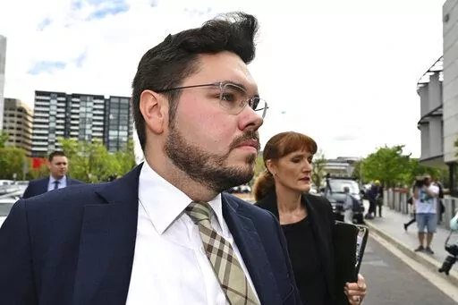 Former Liberal Party staff member Bruce Lehrmann arrives at the Australian Capital Territory Supreme Court in Canberra, Thursday, Oct. 27, 2022. A judge on Thursday discharged a jury in the high-profile trial of Lehrmann, a former government advisor, charged with raping a colleague in the Australian Parliament House because a juror had brought a research paper on sexual assaults into the jury room. (Mick Tsikas/AAP Image via AP)