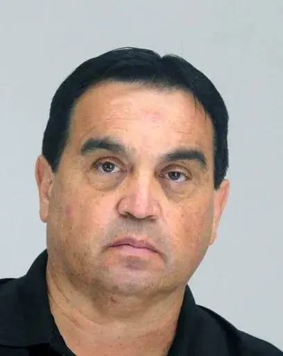 This photo provided by the Dallas Police Department shows Dr. Raynaldo Rivera Ortiz. Jr.  Dr. Raynaldo Rivera Ortiz. Jr. a Dallas anesthesiologist was arrested Wednesday, Sept. 14, 2022 after federal investigators accused him of tampering with patients’ bags of intravenous fluids. (Dallas Police Department via AP)