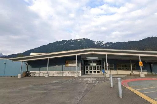 The Glacier Valley Elementary School is seen in Juneau, Alaska, on Tuesday, June 14, 2022. A dozen students and two adults were served floor sealant instead of milk at the school after containers were apparently mixed up, the superintendent said Wednesday. Several children complained of burning sensations in their mouth and throats, and at least one child was treated at the local hospital after the Tuesday morning mix-up, Superintendent Bridget Weiss said. (Ben Hohenstatt/The Juneau Empire via A