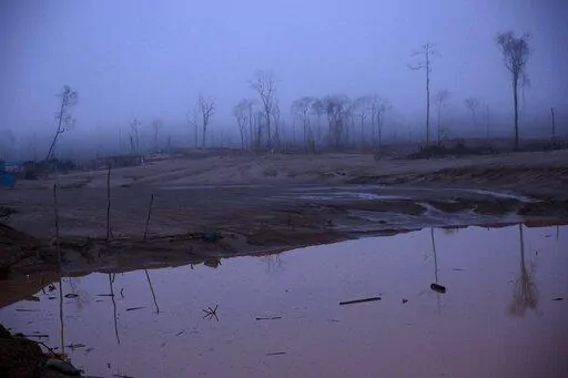 This Wednesday, Feb. 24, 2016 photo shows the deforestation of what was once pristine rainforest, caused by gold mining, during a government raid on illegal wildcat mining operations in La Pampa, in Peru's Madre de Dios region. The Monitoring of the Andean Amazon Project, an initiative of the nonprofit Amazon Conservation Association, reported on Thursday, June 2, 2022, that deforestation in the Peruvian Amazon has hit six historical highs in the past ten years.  (AP Photo/Rodrigo Abd, FIle)