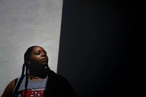 Black Lives Matter co-founder Patrisse Cullors stands for a photo at Crenshaw Dairy Mart, an art gallery and studio space co-founded by Cullors, in Inglewood, Calif., Tuesday, April 19, 2022.