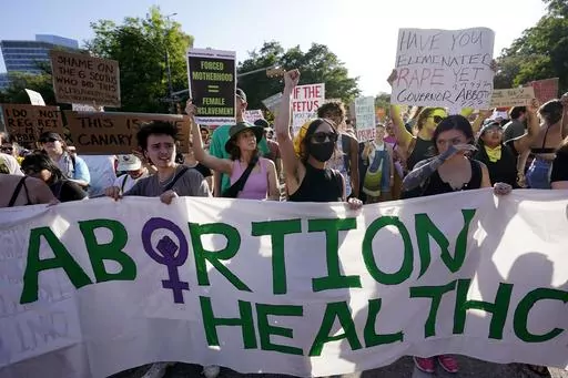 Demonstrators march and gather near the Texas state Capitol in Austin following the Supreme Court's decision to overturn Roe v. Wade on June 24, 2022. A pregnant Texas woman whose fetus has a fatal diagnosis asked a court Tuesday, Dec. 5, 2023, to let her terminate the pregnancy, bringing what her attorneys say is the first lawsuit of its kind in the U.S. since Roe v. Wade was overturned last year. (AP Photo/Eric Gay, File)