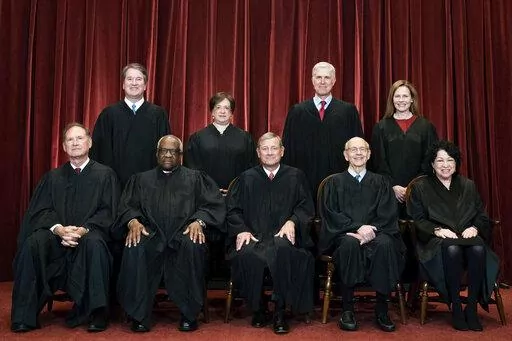 Members of the Supreme Court pose for a group photo at the Supreme Court in Washington, April 23, 2021. Seated from left are Associate Justice Samuel Alito, Associate Justice Clarence Thomas, Chief Justice John Roberts, Associate Justice Stephen Breyer and Associate Justice Sonia Sotomayor, Standing from left are Associate Justice Brett Kavanaugh, Associate Justice Elena Kagan, Associate Justice Neil Gorsuch and Associate Justice Amy Coney Barrett. (Erin Schaff/The New York Times via AP, Pool)