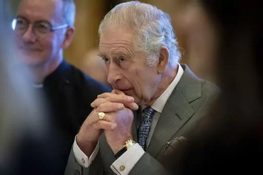 Britain's King Charles III hosts a gathering of young UK community and faith leaders to discuss the challenges their communities face, at Buckingham Palace, in London, Wednesday, Dec. 13, 2023. Buckingham Palace says King Charles III will undergo a “corrective procedure” next week for an enlarged prostate. (Aaron Chown/Pool Photo via AP, File)