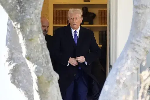President Donald Trump walks from the Oval Office to departing on Marine One from the South Lawn of the White House, Friday, Feb. 14, 2025, in Washington. (AP Photo/Alex Brandon)