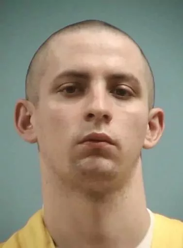 This image provided by the Mississippi Department of Corrections shows Axel Cox, 24, of Gulfport, Miss. Cox, who burned a cross in his front yard to intimidate his Black neighbors in December 2020, was sentenced Thursday, March 9, 2023, to 42 years in prison. (Mississippi Department of Corrections via AP, File)